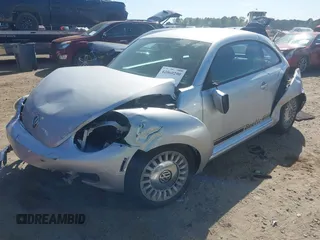 2014 Volkswagen Beetle 2.5L w/Sun with VIN 3VWJP7AT7EM633386, listed as a IAAI auction lot 42060290 with 273,374 mi miles and . Bid and sale history available at DreamBid. Image 2.