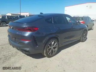 2021 BMW X6 M50i with VIN 5UXCY8C07M9E32426, listed as a IAAI auction lot 41715641 with 23,000 mi miles. Bid and sale history available at carsss.com. Image 4.