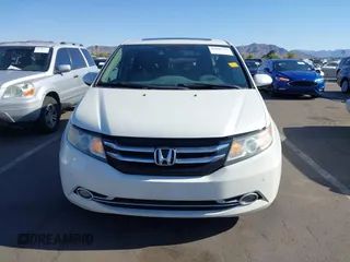 2014 Honda Odyssey Touring with VIN 5FNRL5H97EB037361, listed as a IAAI auction lot 42106742 with 198,279 mi miles and . Bid and sale history available at DreamBid. Image 6.