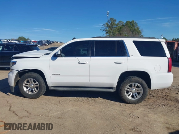 2015 Chevrolet Tahoe LT with VIN 1GNSCBKC0FR104096, listed as a IAAI auction lot 41679298 with 231,005 mi miles and . Bid and sale history available at DreamBid. Image 14.