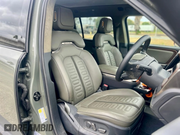 2023 Rivian R1S Launch Edition with VIN 7PDSGABL2PN003733, listed as a Copart auction lot 56033315 with 9,996 mi miles and Salvage Title. Bid and sale history available at carsss.com. Image 5.