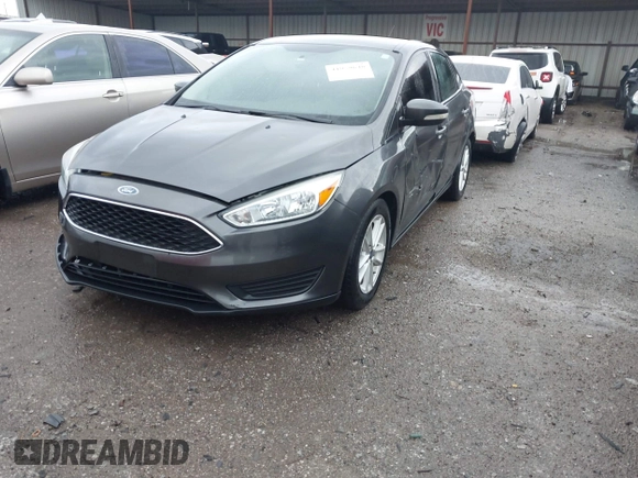 2015 Ford Focus SE with VIN 1FADP3F28FL219552, listed as a IAAI auction lot 41959648 with 128,590 mi miles. Bid and sale history available at carsss.com. Image 2.