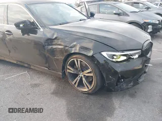 2021 BMW 3 Series 330i with VIN 3MW5R1J02M8B95303, listed as a IAAI auction lot 42184843 with 55,928 mi miles and . Bid and sale history available at carsss.com. Image 6.