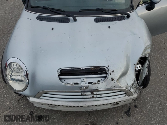 2005 MINI Convertible S with VIN WMWRH33575TK56034, listed as a Copart auction lot 88043565 with 33,410 mi miles and Salvage title. Bid and sale history available at DreamBid. Image 11.