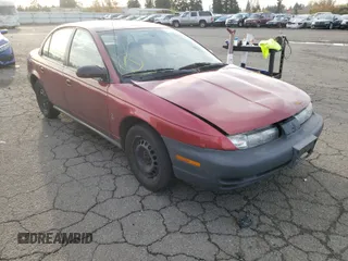 1999 Saturn SL with VIN 1G8ZH5286XZ192072, listed as a Copart auction lot 80973254 with 254,855 mi miles and Salvage Title. Bid and sale history available at carsss.com. Image 1.
