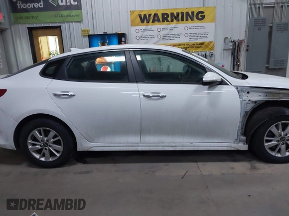 2018 Kia Optima S with VIN 5XXGT4L35JG209737, listed as a IAAI auction lot 41806505 with 98,869 mi miles and . Bid and sale history available at DreamBid. Image 14.