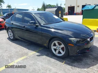 2014 BMW 3 Series 320i with VIN WBA3B1C55EK135357, listed as a IAAI auction lot 42158550 with 148,911 mi miles. Bid and sale history available at carsss.com. Image 1.
