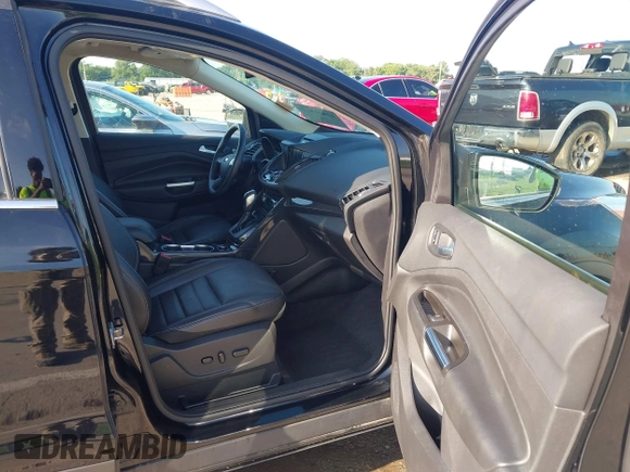 2016 Ford Escape Titanium with VIN 1FMCU9J97GUC21242, listed as a IAAI auction lot 42431567 with 96,946 mi miles and . Bid and sale history available at DreamBid. Image 5.