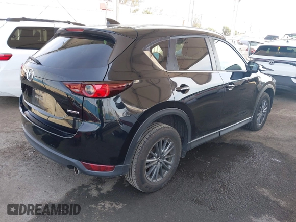 2020 Mazda CX-5 Touring with VIN JM3KFACM0L0804998, listed as a IAAI auction lot 41850998 with 44,519 mi miles. Bid and sale history available at carsss.com. Image 4.