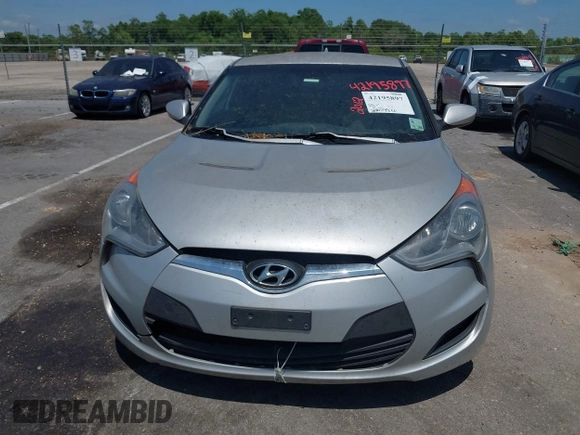 2012 Hyundai Veloster w/Gray Int z VIN KMHTC6ADXCU049918, wystawiony jako IAAI lot #42195897 z przebiegiem 206 033 mil mil oraz . Historia ofert i sprzedaży dostępna na DreamBid. Obrazek 6.
