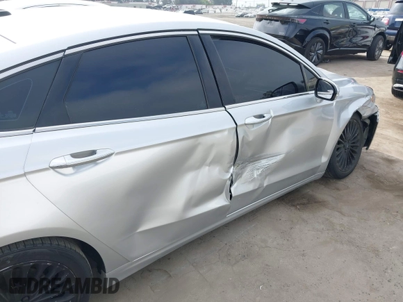 2016 Ford Fusion Titanium z VIN 3FA6P0K92GR135076, wystawiony jako IAAI lot #42604875 z przebiegiem 192 785 mil mil oraz . Historia ofert i sprzedaży dostępna na DreamBid. Obrazek 17.