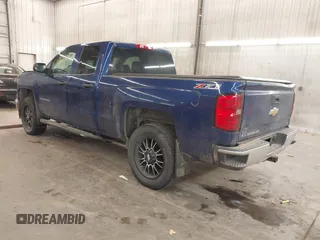 2014 Chevrolet Silverado 1500 LT with VIN 1GCVKREC2EZ155062, listed as a IAAI auction lot 41260471 with 135,762 mi miles and . Bid and sale history available at DreamBid. Image 3.