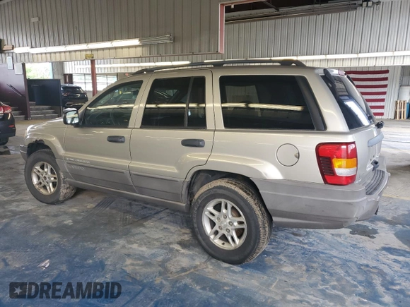 2003 Jeep Grand Cherokee Laredo with VIN 1J4GW48S43C567559, listed as a Copart auction lot 61431595 with 249,998 mi miles and Salvage title. Bid and sale history available at DreamBid. Image 2.