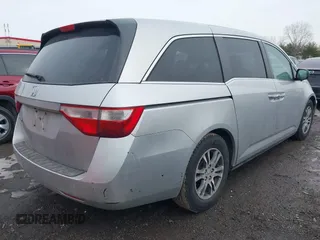2013 Honda Odyssey EX-L with VIN 5FNRL5H63DB007682, listed as a IAAI auction lot 41408103 with 201,453 mi miles and . Bid and sale history available at carsss.com. Image 4.