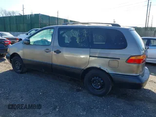 1999 Toyota Sienna LE with VIN 4T3ZF13CXXU121819, listed as a IAAI auction lot 41607624 with 999,999 mi miles. Bid and sale history available at carsss.com. Image 3.