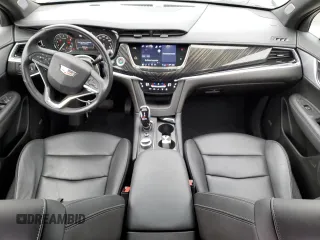 2023 Cadillac XT6 FWD Premium Luxury z VIN 1GYKPCRS5PZ119186, wystawiony jako Copart lot #50577175 z przebiegiem 32 189 mil mil oraz Szkoda całkowita • Salvage title. Historia ofert i sprzedaży dostępna na DreamBid. Obrazek 8.