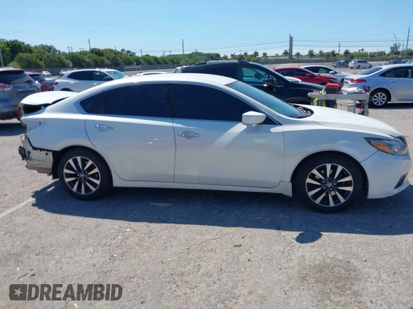 2016 Nissan Altima SV with VIN 1N4AL3AP9GC135114, listed as a IAAI auction lot 41851507 with 127,033 mi miles and . Bid and sale history available at DreamBid. Image 14.