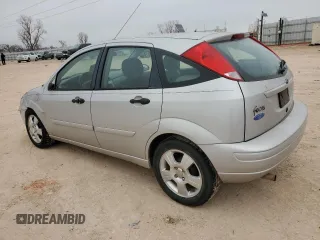 2004 Ford Focus with VIN 3FAFP37Z14R102723, listed as a Copart auction lot 44138195 with 220,354 mi miles and Salvage title. Bid and sale history available at DreamBid. Image 2.