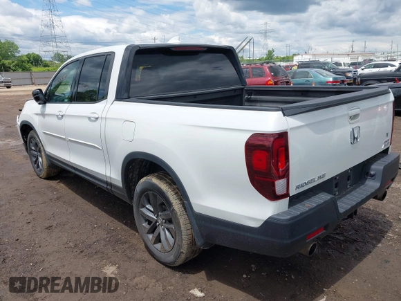 2021 Honda Ridgeline Sport with VIN 5FPYK3F14MB005117, listed as a IAAI auction lot 42343059 with 58,862 mi miles and . Bid and sale history available at DreamBid. Image 3.