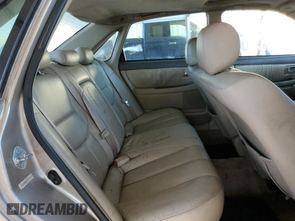 2000 Toyota Avalon XL z VIN 4T1BF28B2YU079163, wystawiony jako Copart lot #50129935 z przebiegiem 311 916 mil mil oraz Nie do naprawy • Non repairable. Historia ofert i sprzedaży dostępna na DreamBid. Obrazek 10.