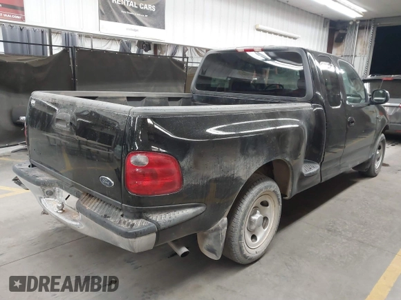 2001 Ford F-150 XL with VIN 1FTRX07W61KF82074, listed as a IAAI auction lot 41444721 with 125,494 mi miles. Bid and sale history available at carsss.com. Image 4.