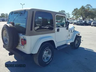 2001 Jeep Wrangler Sahara with VIN 1J4FA59S51P332107, listed as a IAAI auction lot 40954726 with 150,671 mi miles. Bid and sale history available at carsss.com. Image 4.