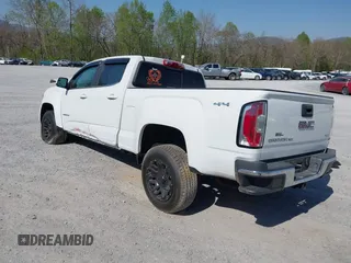 2019 GMC Canyon 4WD SLE z VIN 1GTG6CEN0K1353094, wystawiony jako IAAI lot #42065160 z przebiegiem 73 235 mil mil oraz . Historia ofert i sprzedaży dostępna na DreamBid. Obrazek 3.