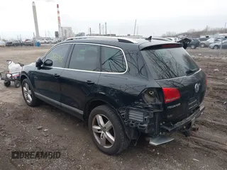 2012 Volkswagen Touareg Sport with VIN WVGFK9BP7CD002243, listed as a IAAI auction lot 41863765 with 136,231 mi miles and . Bid and sale history available at DreamBid. Image 3.