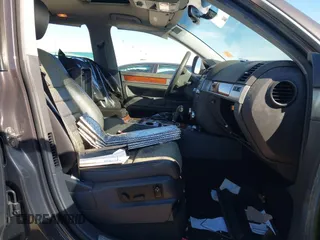 2010 Volkswagen Touareg VR6 with VIN WVGBF7A95AD002412, listed as a IAAI auction lot 41259491 with 94,104 mi miles and . Bid and sale history available at DreamBid. Image 5.