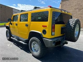 2003 Hummer H2 with VIN 5GRGN23UX3H112710, listed as a Copart auction lot 72082654 with 64,186 mi miles and Salvage Title. Bid and sale history available at carsss.com. Image 3.