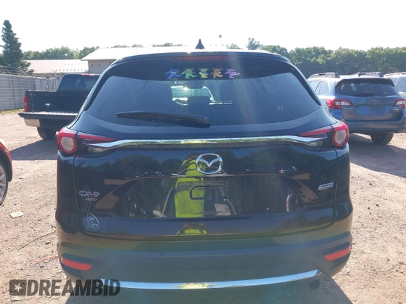 2018 Mazda CX-9 Grand Touring with VIN JM3TCBDYXJ0208962, listed as a IAAI auction lot 42629720 with 123,929 mi miles and . Bid and sale history available at DreamBid. Image 17.