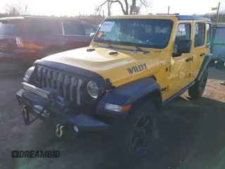 2021 Jeep Wrangler Unlimited Sport S z VIN 1C4HJXDN6MW597477, wystawiony jako IAAI lot #41089112 z przebiegiem 82 315 mil mil oraz . Historia ofert i sprzedaży dostępna na DreamBid. Obrazek 17.