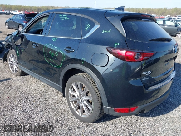 2019 Mazda CX-5 Grand Touring with VIN JM3KFBDM7K0525650, listed as a IAAI auction lot 42032757 with 65,530 mi miles and . Bid and sale history available at DreamBid. Image 3.