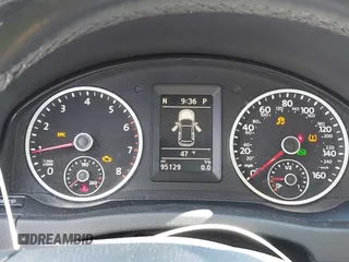 2014 Volkswagen Tiguan SE z VIN WVGAV3AX0EW511694, wystawiony jako IAAI lot #41811345 z przebiegiem 95 129 mil mil oraz . Historia ofert i sprzedaży dostępna na DreamBid. Obrazek 7.