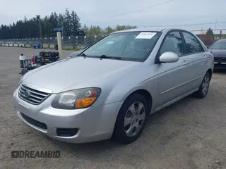2009 Kia Spectra EX with VIN KNAFE221595659217, listed as a IAAI auction lot 42014406 with 140,527 mi miles. Bid and sale history available at carsss.com. Image 2.