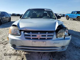 2003 Hyundai Accent with VIN KMHCF35C73U273610, listed as a Copart auction lot 85868294 with 168,203 mi miles and Salvage Title. Bid and sale history available at carsss.com. Image 5.