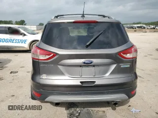2013 Ford Escape Titanium z VIN 1FMCU0J98DUB64363, wystawiony jako Copart lot #54772925 z przebiegiem 109 956 mil mil oraz Szkody całkowita. Historia ofert i sprzedaży dostępna na DreamBid. Obrazek 6.
