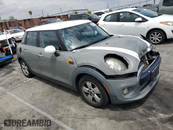 2015 MINI Hardtop 4 Door with VIN WMWXS5C56FT828846, listed as a Copart auction lot 54943765 with 78,964 mi miles and Salvage Title. Bid and sale history available at DreamBid. Image 4.