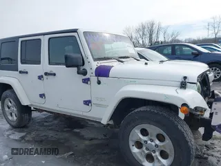 2010 Jeep Wrangler Unlimited Sahara with VIN 1J4HA5H19AL177179, listed as a IAAI auction lot 41565342 with 181,392 mi miles. Bid and sale history available at carsss.com. Image 14.