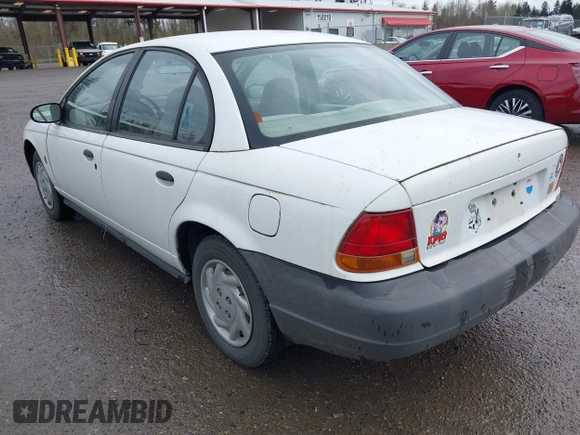 1997 Saturn SL with VIN 1G8ZF5283VZ400170, listed as a IAAI auction lot 41884490 with 171,635 mi miles. Bid and sale history available at carsss.com. Image 3.