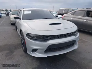 2023 Dodge Charger Scat Pack Widebody with VIN 2C3CDXGJ6PH561869, listed as a IAAI auction lot 41674979 with 6,754 mi miles. Bid and sale history available at carsss.com. Image 1.