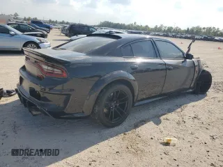 2022 Dodge Charger SRT Hellcat Widebody z VIN 2C3CDXL91NH106016, wystawiony jako Copart lot #72100084 z przebiegiem Nie podano mil oraz Nie do naprawy • Non repairable. Historia ofert i sprzedaży dostępna na DreamBid. Obrazek 3.