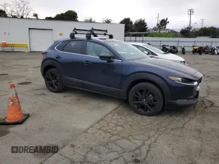 2022 Mazda CX-30 Premium with VIN 3MVDMBDY1NM446064, listed as a Copart auction lot 46527505 with 20,742 mi miles and Salvage Title. Bid and sale history available at DreamBid. Image 4.
