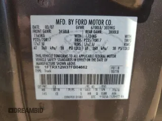 2007 Ford F-150 STX with VIN 1FTRX12W37FB04662, listed as a Copart auction lot 54192815 with 123,863 mi miles and Salvage title. Bid and sale history available at DreamBid. Image 12.