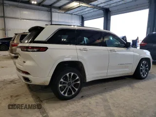 2022 Jeep Grand Cherokee Overland with VIN 1C4RJYD68N8716557, listed as a Copart auction lot 86807614 with 12,590 mi miles and Salvage title. Bid and sale history available at DreamBid. Image 3.
