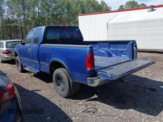 1997 Ford F-150 XL with VIN 1FTDX18W4VNB57679, listed as a IAAI auction lot 41918107 with 132,960 mi miles. Bid and sale history available at carsss.com. Image 3.