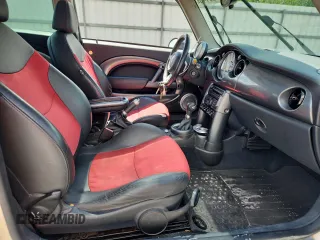 2006 MINI Hardtop S with VIN WMWRE33556TJ38543, listed as a Copart auction lot 62420145 with 105,656 mi miles and Salvage title. Bid and sale history available at DreamBid. Image 7.