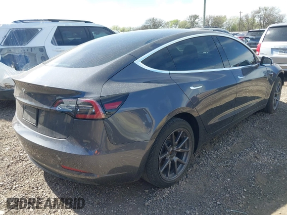 2019 Tesla Model 3 Mid Range with VIN 5YJ3E1EA5KF327679, listed as a IAAI auction lot 41804379 with 87,208 mi miles and . Bid and sale history available at DreamBid. Image 4.