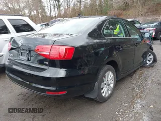 2015 Volkswagen Jetta Sedan 1.8T SE with VIN 3VWD17AJ3FM225093, listed as a IAAI auction lot 41974219 with 69,061 mi miles. Bid and sale history available at carsss.com. Image 4.