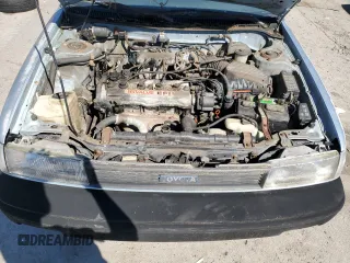 1990 Toyota Corolla z VIN JT2AE94A3L3318946, wystawiony jako Copart lot #59189514 z przebiegiem 115 252 mil mil oraz Czysty tytuł • Clean title. Historia ofert i sprzedaży dostępna na DreamBid. Obrazek 11.
